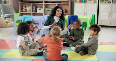 Woman, teacher and kids with nursery activity for fun learning, education or social interaction at kindergarten. Female person, educator or instructor with children in sing along, classroom or school