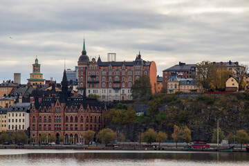 Historic Architecture of Södermalm in Stockholm on Cloudy Autumn Day, Scenic view of Södermalm district with historic buildings by the water in Stockholm, Sweden