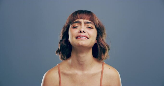 Woman, crying face and frustration for stress, anxiety and grumpy with profile by gray background. Young student, education burnout and upset or frustrated in class, tired of exams in studio mockup