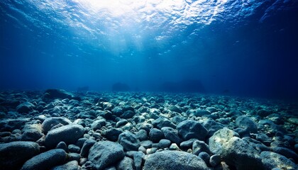Fototapeta premium Dark blue ocean seen from underwater Dead seabed of stones and rocks