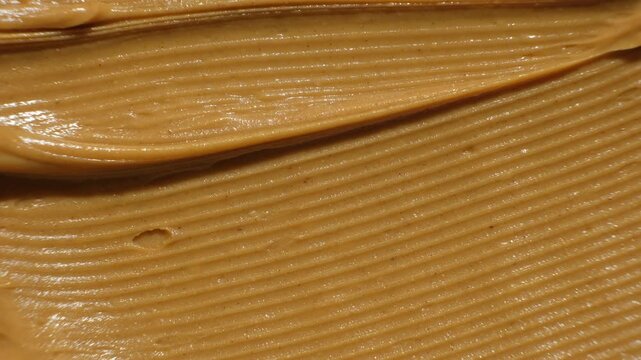 Smooth Peanut Butter Texture. Overhead Food Background for Recipes or Ads
