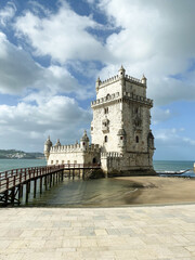 A beautiful view of the Belem Tower in Lisbon, Portugal, standing by the water.