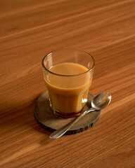 Traditional Indonesian Bajigur Warm Sweet Coconut Milk and Palm Sugar Drink Served in a Glass.