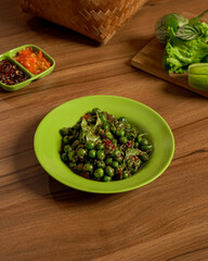 Cobek Leunca Traditional Indonesian Spicy Green Nightshade Salad with Sambal and Fresh Herbs