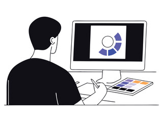 A designer working on a computer, focusing on color and data analysis.