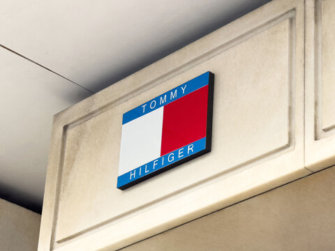 Tommy hilfiger storefront signage with iconic blue white red logo