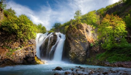 Fototapeta premium Shdugra Waterfall on rocky cliff