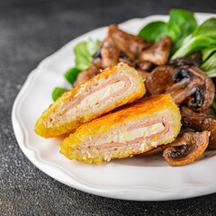 Cordon Bleu Cutlet meat chicken, ham, cheese appetizer dish fresh delicious gourmet food background on the table rustic food top view copy space