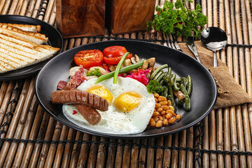 Traditional Engrlish breakfast with egg  and sausages