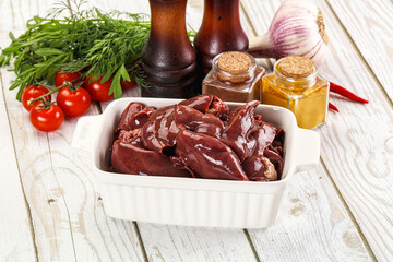 Raw chicken liver uncooked in the bowl
