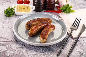 Delicous natural roasted sausages in the plate