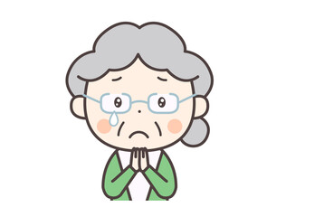 手を合わせて泣いている高齢者の女性