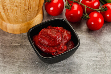 Red tomato paste in the bowl