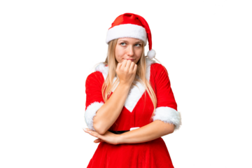 Young blonde woman with christmas hat over isolated chroma key background having doubts