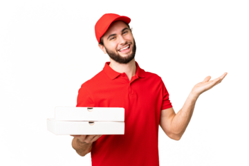 pizza delivery man with work uniform picking up pizza boxes over isolated chroma key background extending hands to the side for inviting to come