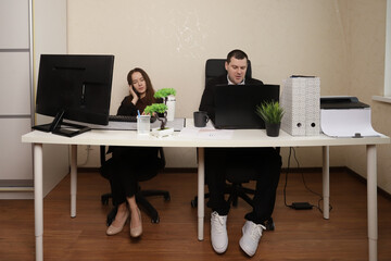 Teamwork and Collaboration Between Two Business Professionals at Modern Office Workspace