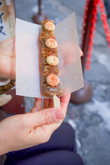 "Kushi senbei" is a type of Japanese rice cracker, specifically a grilled or baked, skewer-shaped senbei