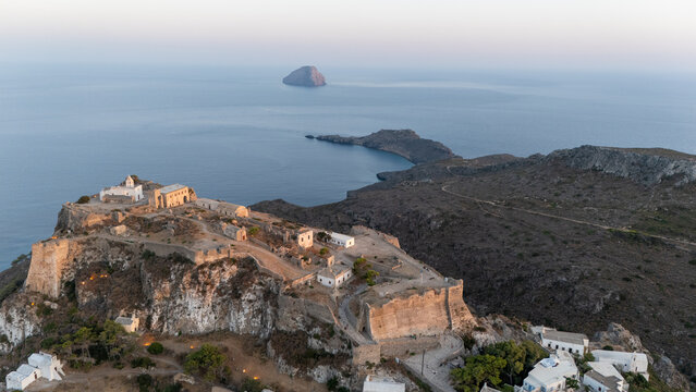 Chora Castle in Kythira - Breathtaking coastal view of a historical fortress overlooking the azure sea at sunset