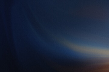 Abstract blurred background with dark blue and orange hues creating a sense of depth and mystery within the frame