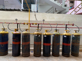 Industrial Gas Cylinders Connected in a Storage Area
