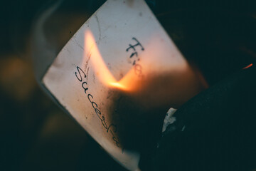 Burning Note With Handwritten Words &ldquo;Friend&rdquo; And &ldquo;Successful&rdquo;