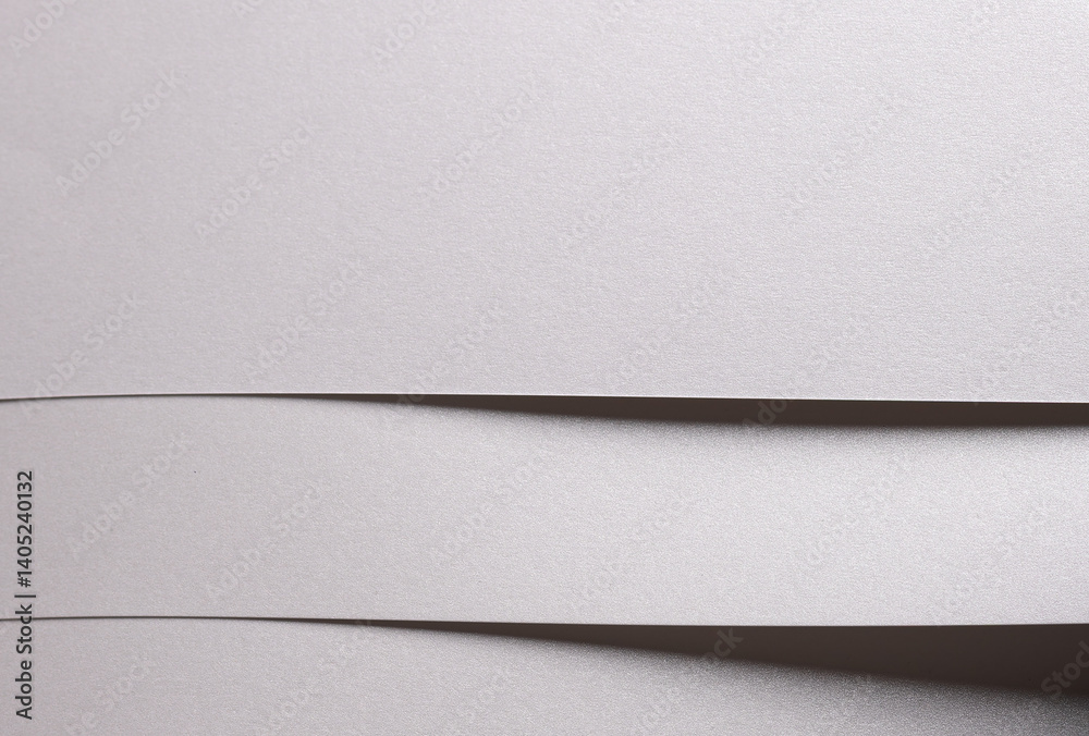 Poster white pearl paper background with a glossy satin texture and layered folded strips. icy silver and p
