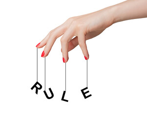 Hand holding a rule or regulation symbol, representing authority and control. Concept of legal...