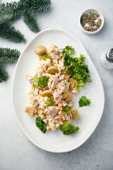 Potato salad with ham and pickled mushrooms