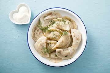 Traditional dumplings served with dill and sour cream