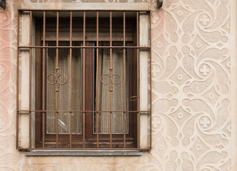 Carved stone wall of historical house in Segovia city