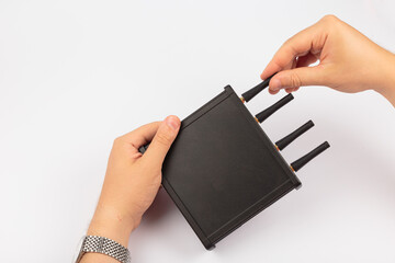 Hands of a master holding an electronic board on a white background