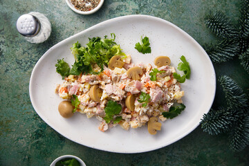 Potato salad with ham and pickled mushrooms