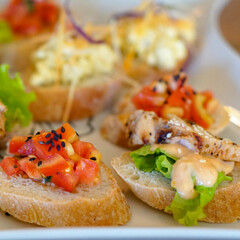 Assorted Bruschetta's on a white plate