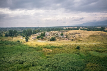 Fototapeta premium Eber village where Eber lake summer houses are located. Aerial view of the village surrounded by forests with a drone. Afyonkarahisar, Turkey.