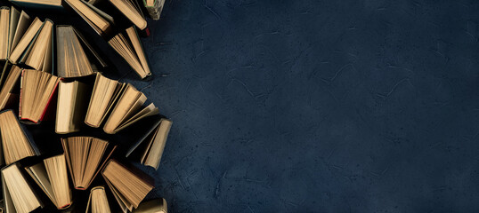 Book background with copy space. Lots of vintage books creating texture for the design. Library concept, classic literature.