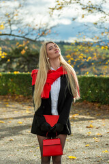 Beautiful woman with long hair enjoying the autumn sunlight