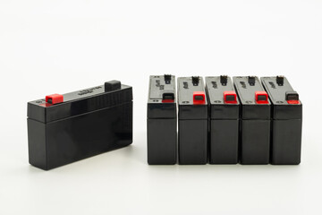 Multiple sealed lead acid batteries isolated on white background for display or sale