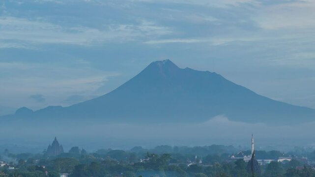  February 5, 2025. 4k timelapse, morning atmosphere in Prambanan area with Sojiwan temple and Mount Merapi in the background.
