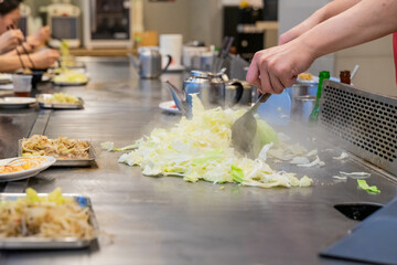 Cabbage teppanyaki is a comforting and flavorful dish that highlights the natural sweetness and crunch of fresh cabbage. Cooked on a sizzling iron plate, the leaves are charred just enough to release