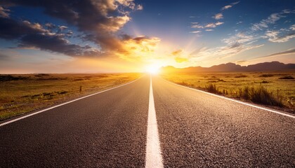 Empty road leading towards the sun