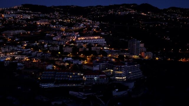 View of Canico de Baixo, Coastal Town with warm illumination on a hillside in Madeira, Portugal