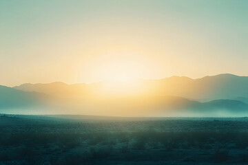 Fototapeta premium Tranquil sunrise over misty mountains, casting warm hues across the serene desert landscape