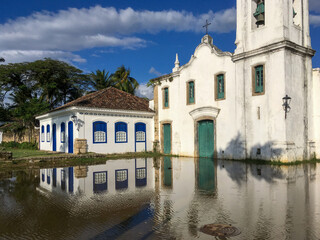 Street with church and reflection in the historical center of Paraty. World Heritage of Humanity,...