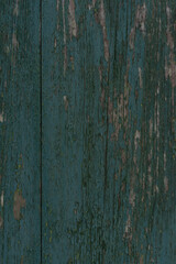 The texture of an old, weathered wooden surface in blue green
