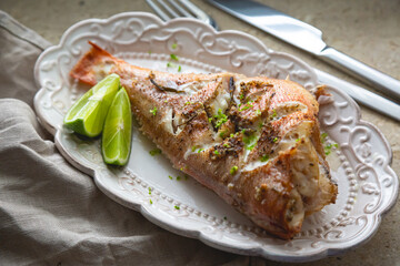 Baked sea bass with herbs and lime