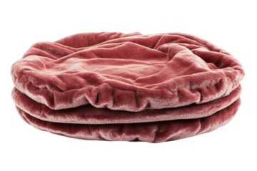 Stacked, round, puckered cushions in a dusty rose hue, exuding comfort and textural intrigue