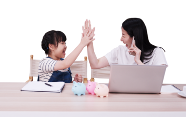 Smiling Asian daughter and mother happy and high five for reaching goal of saving money together. Child educational for homeschooling concept