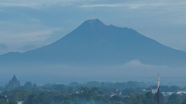  February 5, 2025. 4k timelapse, morning atmosphere in Prambanan area with Sojiwan temple and Mount Merapi in the background.