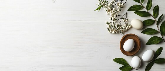 Fototapeta premium Easter Eggs in Wooden Bowl Surrounded by Flowers and Space for Text. Flat Lay Top View