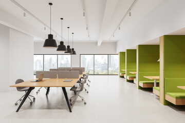 Modern office interior with collaborative workspace and green booth seating under ceiling lights, large windows showing cityscape view in daylight. 3D Rendering